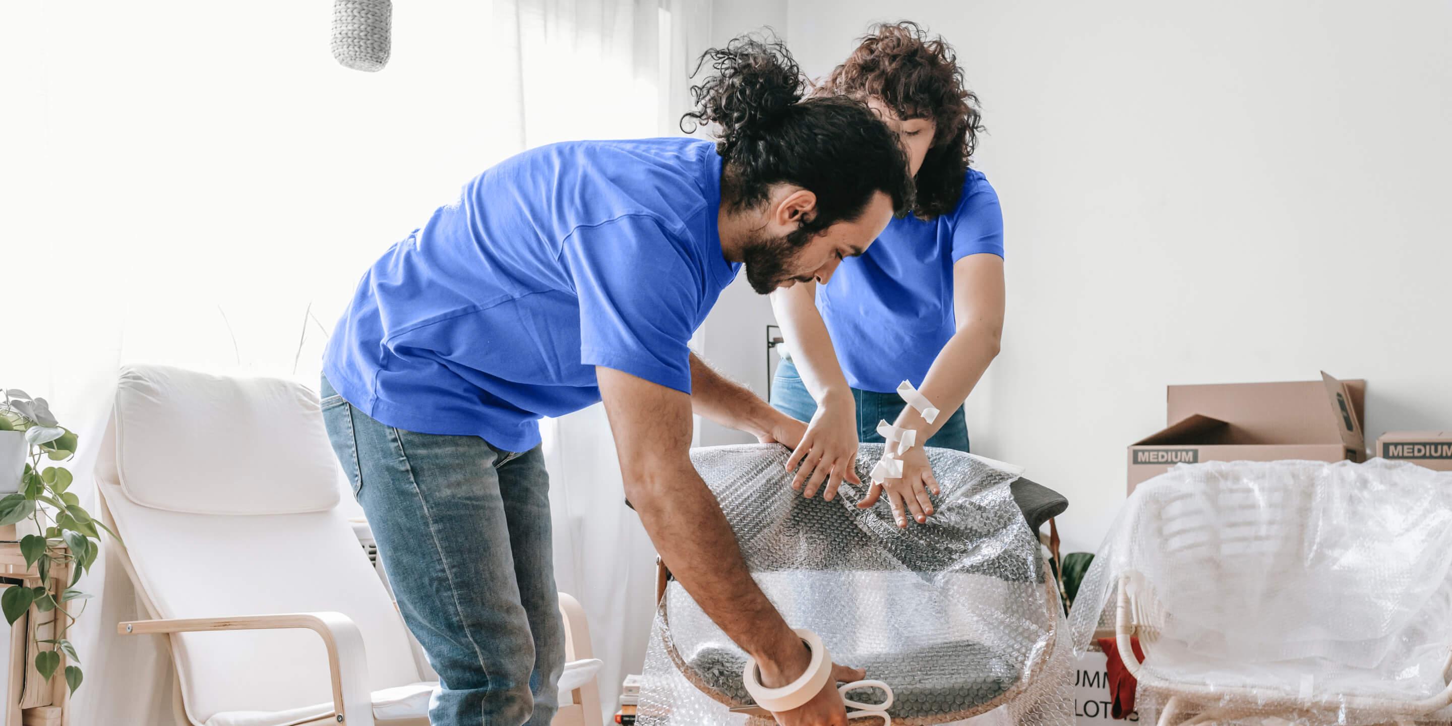 Carefully wrapped furniture pieces and labeled moving boxes ready for transport